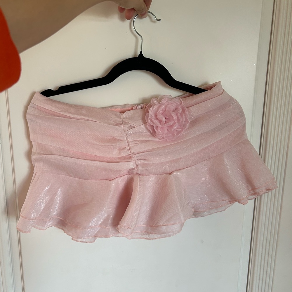 Pink ruched ruffle mini skirt with flower